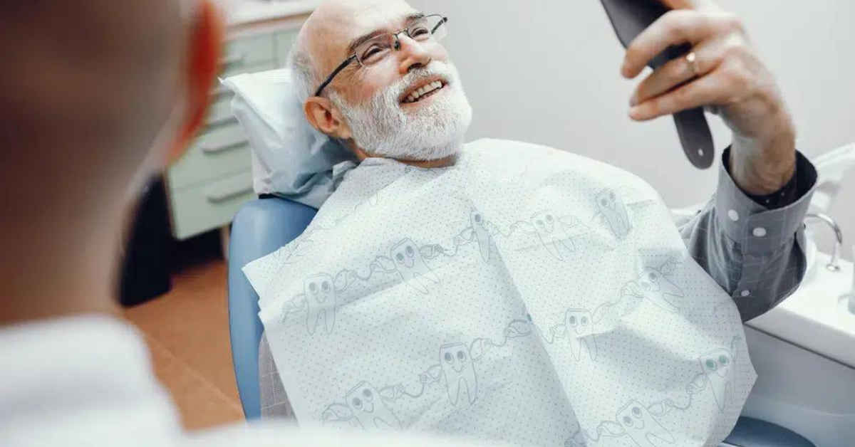 Man smiling in dental office chair.